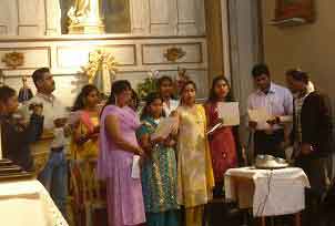 A group of Indians rehearsing the singing in preparation for the liturgy