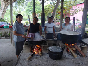 Sr Marta Morales and her helpers preparing a hot meal for groups that meet at their place