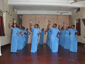 Young Sisters performing for the community